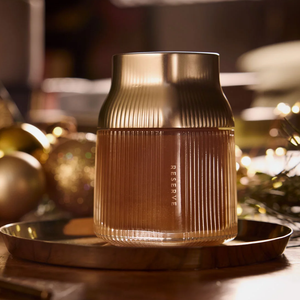 Manuka Honey 'RESERVE' on a table with blurred festive background