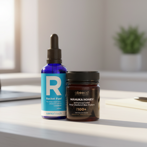 Bottle of Rocket Fuel and jar of Manuka Honey on a office desk