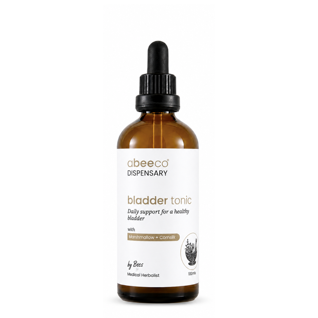 A 100ml amber glass dropper bottle of abeeco Dispensary Bladder Tonic, featuring a white label with gold and black text, set against a plain white background.