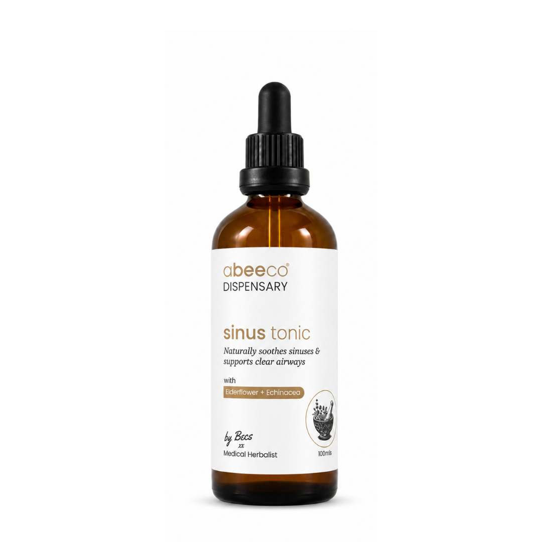 An amber glass dropper bottle of abeeco Dispensary Sinus Tonic with a white label and black dropper cap, centered on a plain white background.