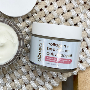Jar of Abeeco collagen + bee Venom activ day lift cream on a textured surface