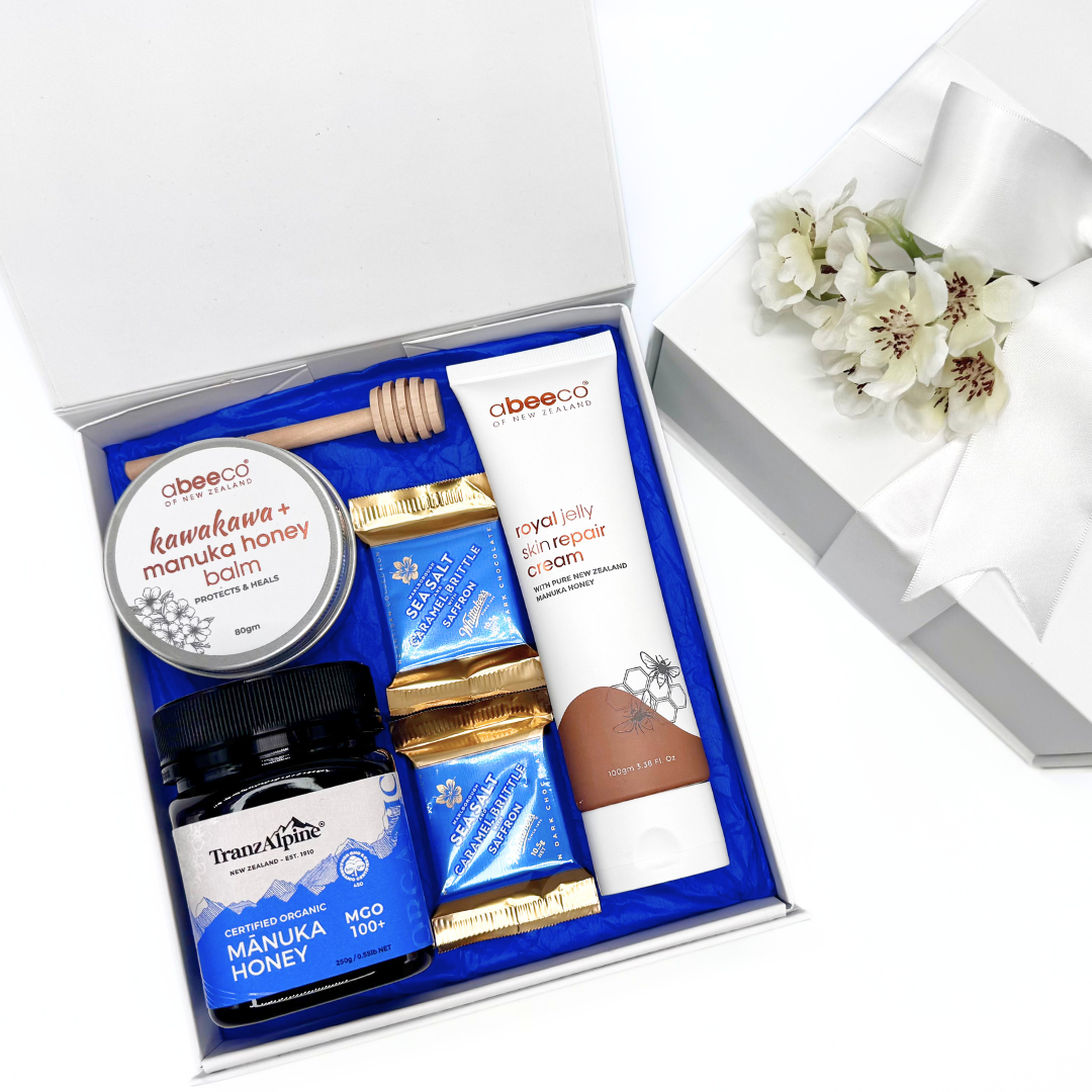Gift for her honey, chocolate and skincare, blue theme in a white box with white bow