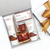 Gift set with abeeoo skincare products and honeycomb, tied with a gold ribbon.