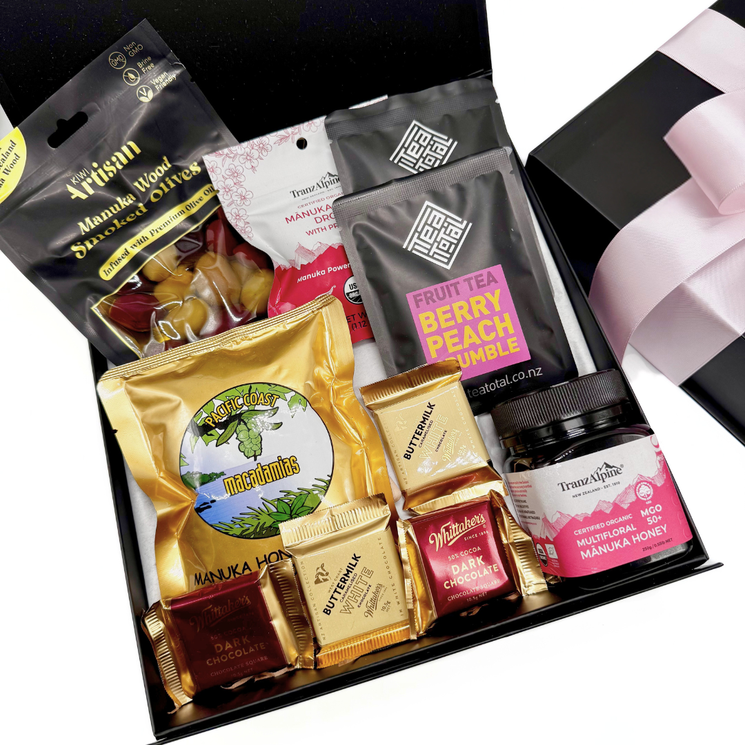 Manuka Treats for her gift basket in a black box with pink bow