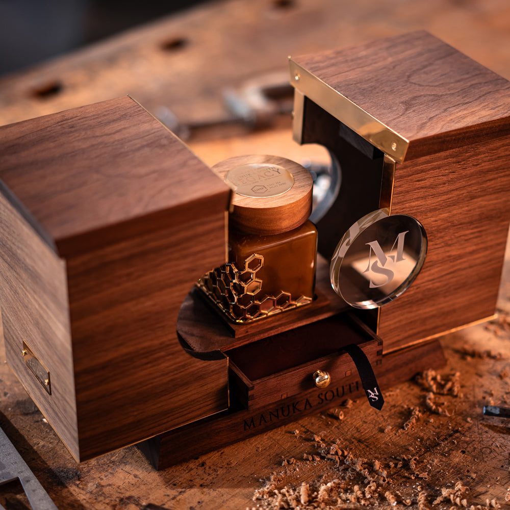 The black walnut presentation case, open, with the jar behind its crystal windows