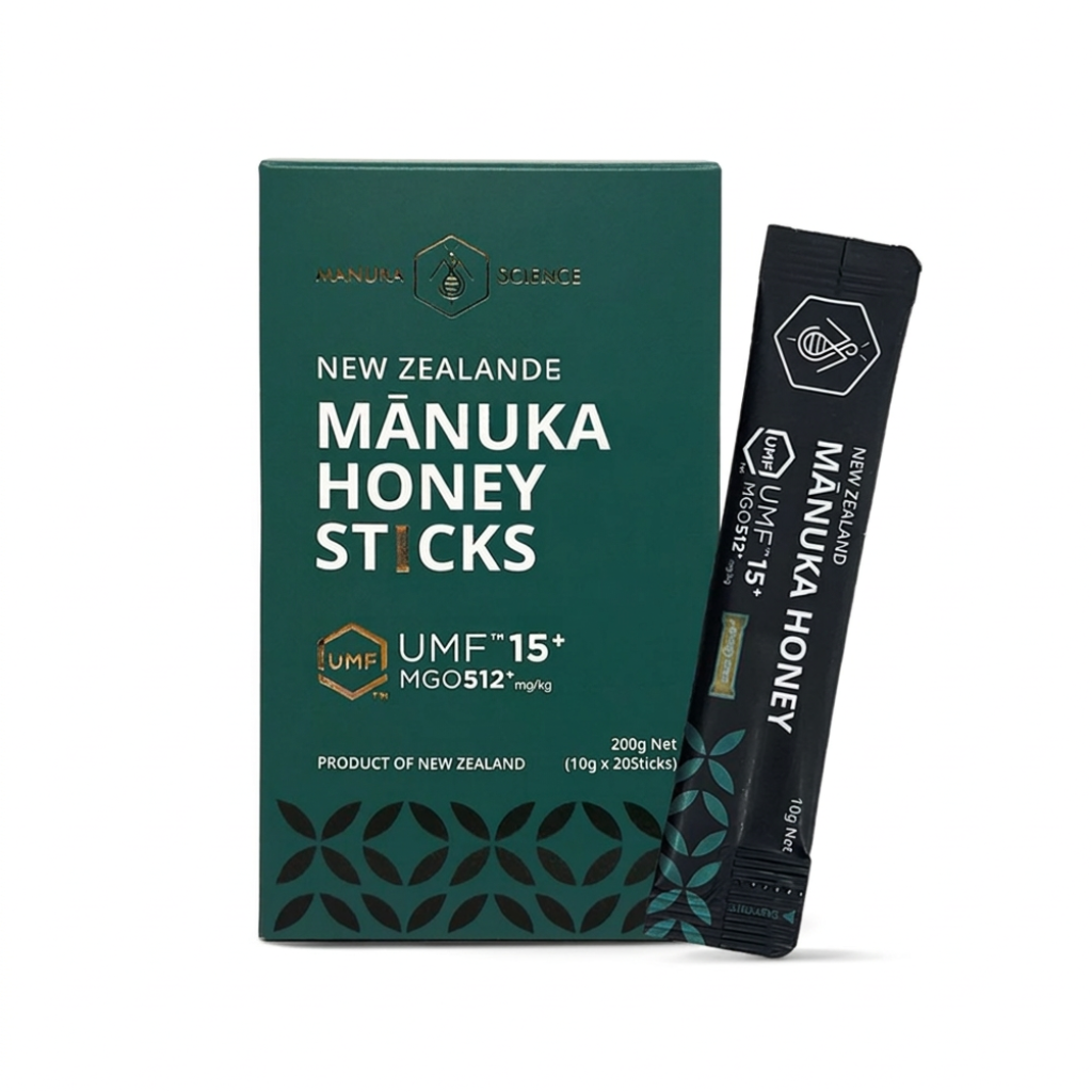 Mânuka Honey Sticks by Manuka Science, featuring a dark green box of New Zealand manuka honey sticks next to a single black stick pack, set against a plain white background.