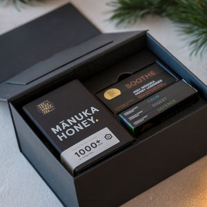 Wellness Box from The True Honey Co open under a christmas tree