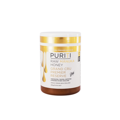 PURITI Grand Cru Premier Reserve Mānuka honey 250g jar with white and gold label.